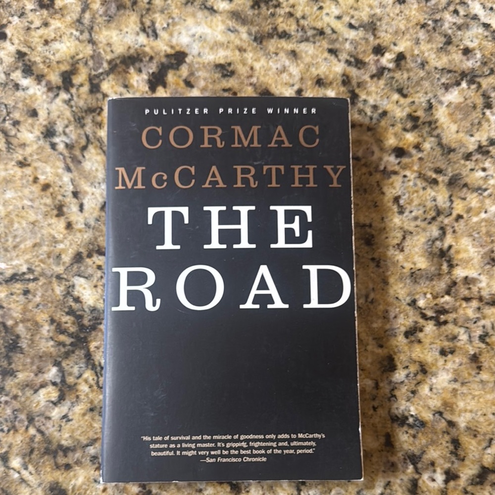 Black Paperback Edition of The Road by Cormac McCarthy